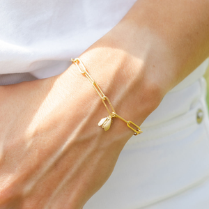 wearing gold bee bracelet