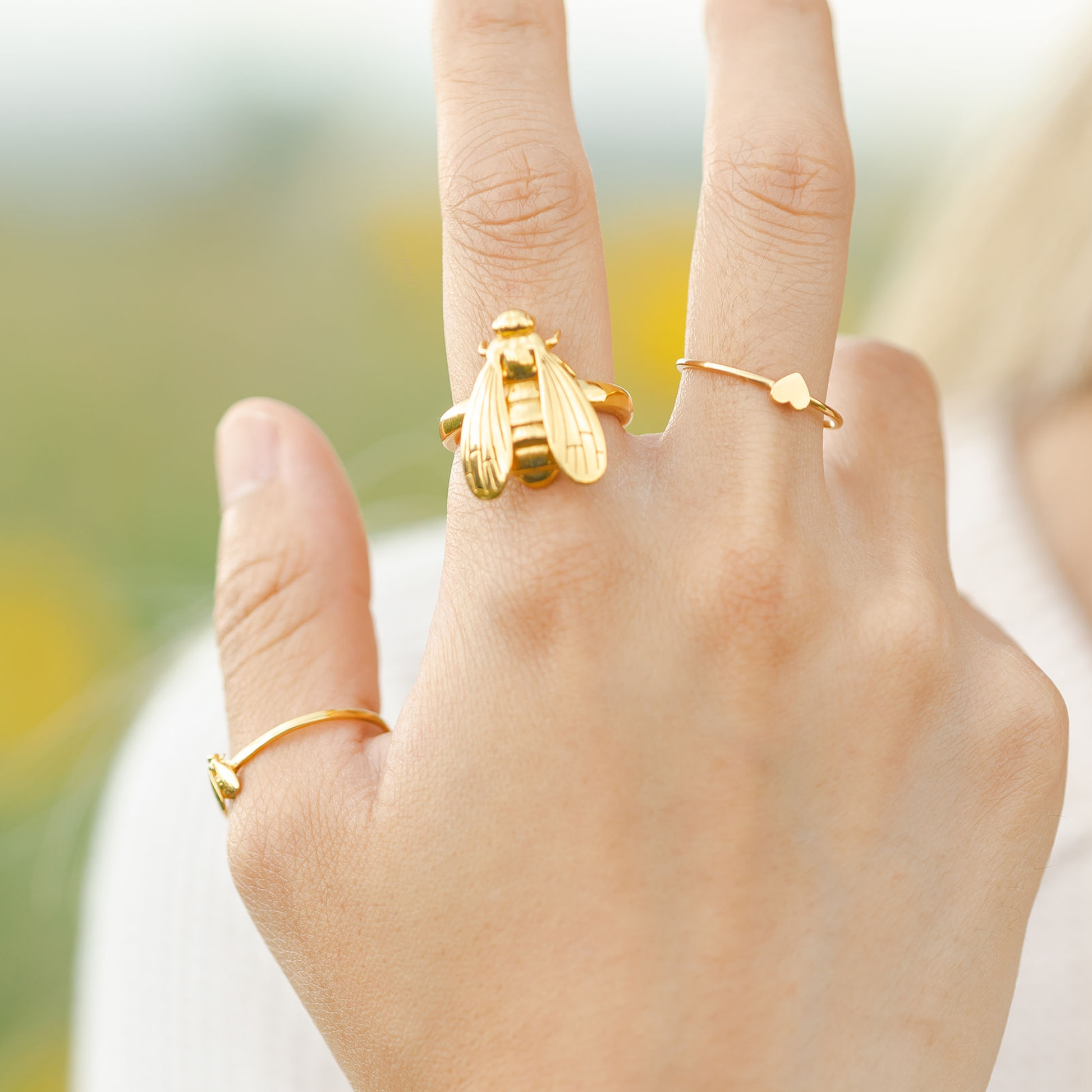 wearing bee pinky ring
