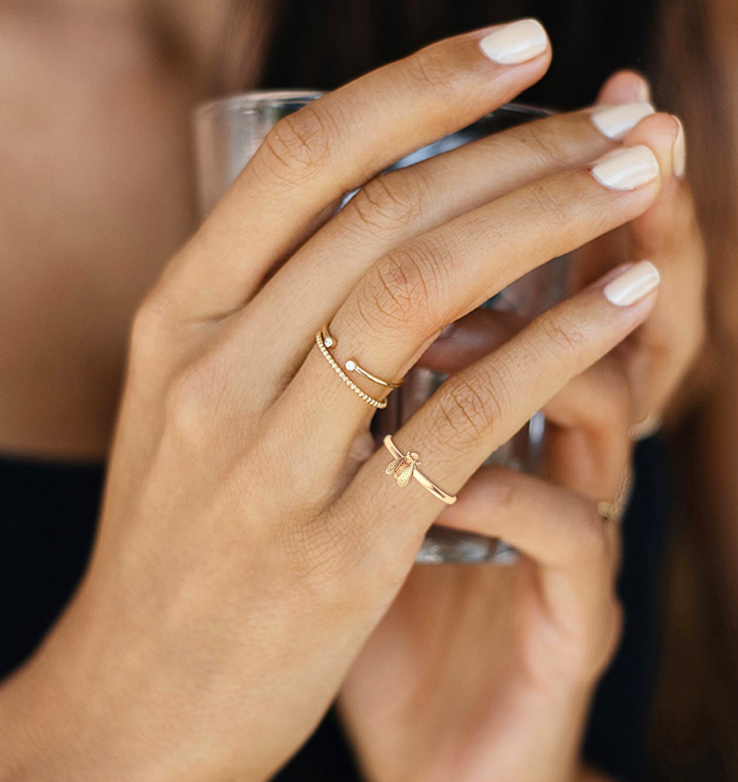 wearing gold bee ring