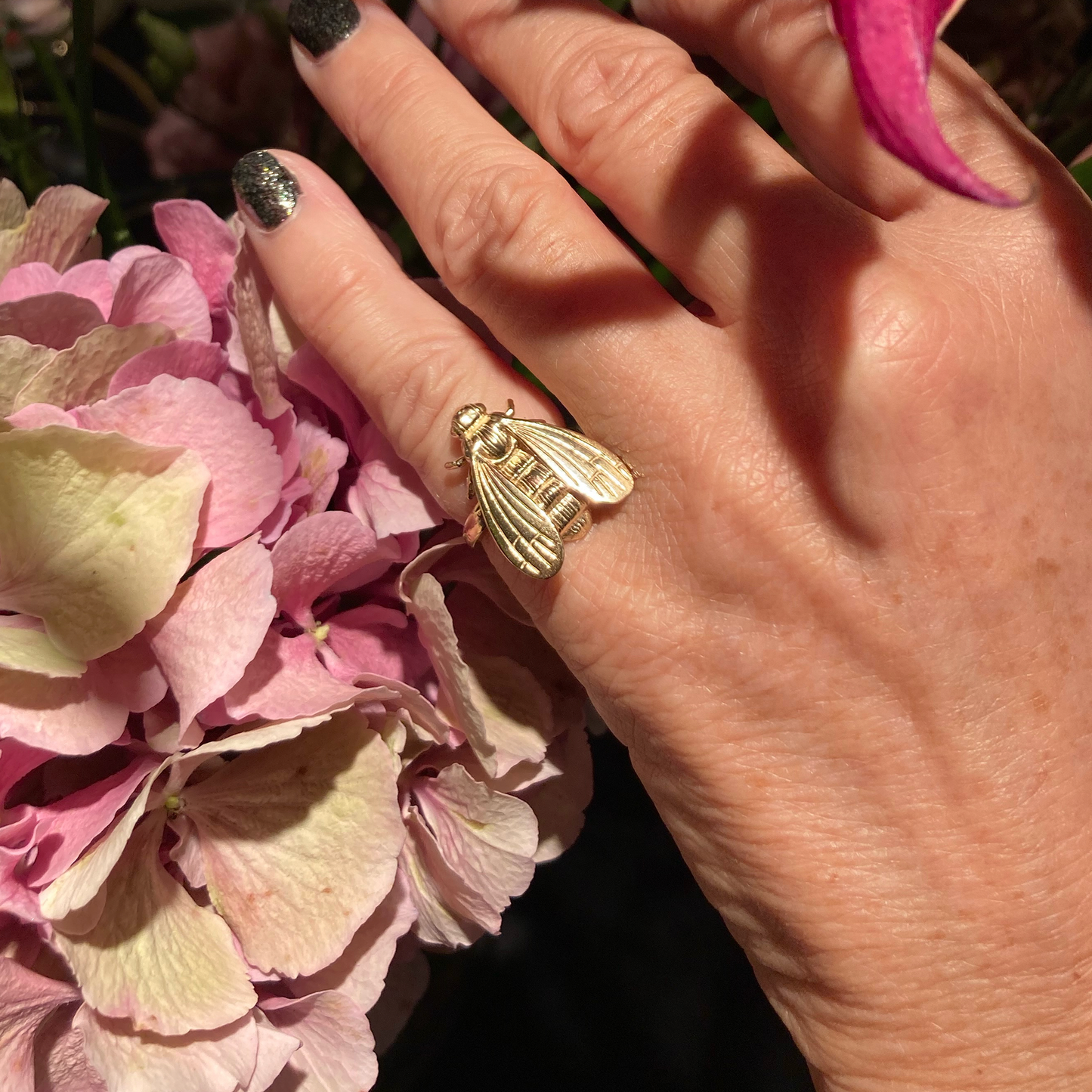 wearing bee pinky ring